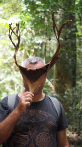 Jordo holding dry stag horn leaf over his face