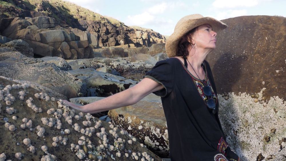 Susie against the rocks at the end of the beach