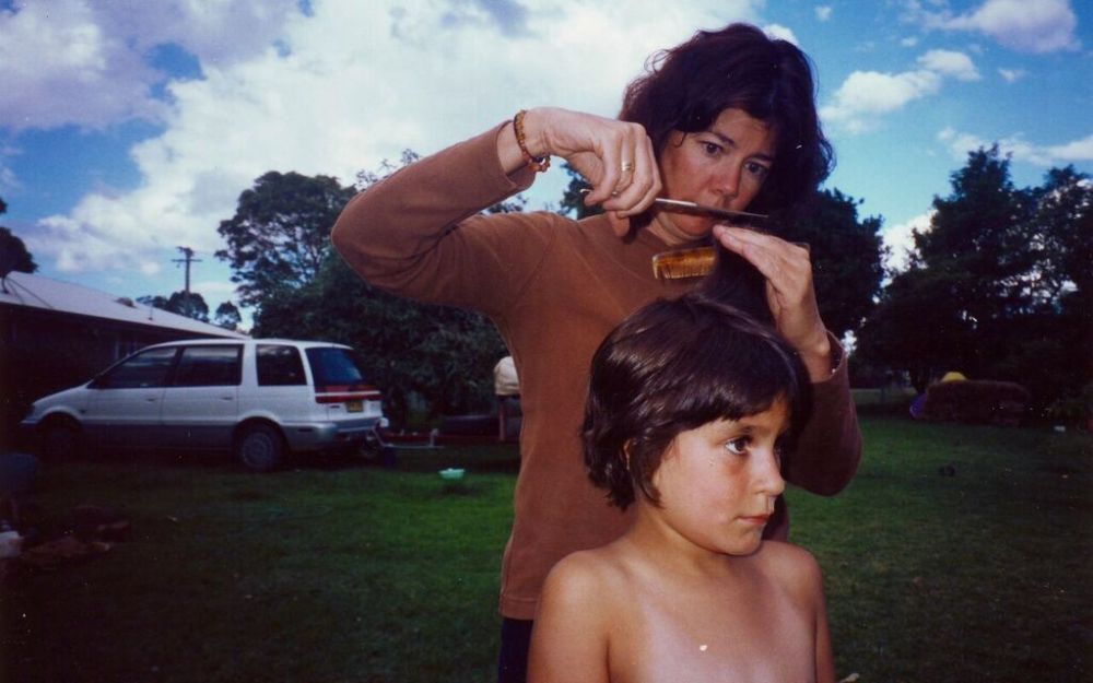 Photoe of Susie cutting Clare's hair